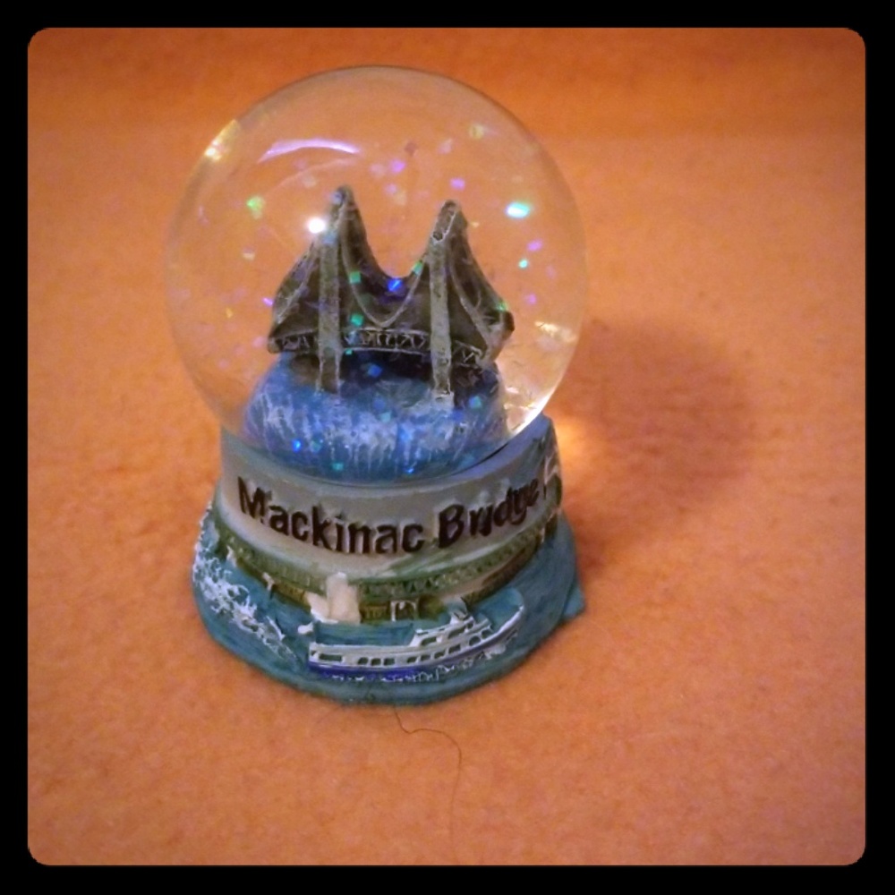 A miniature mackinaw bridge snow globe